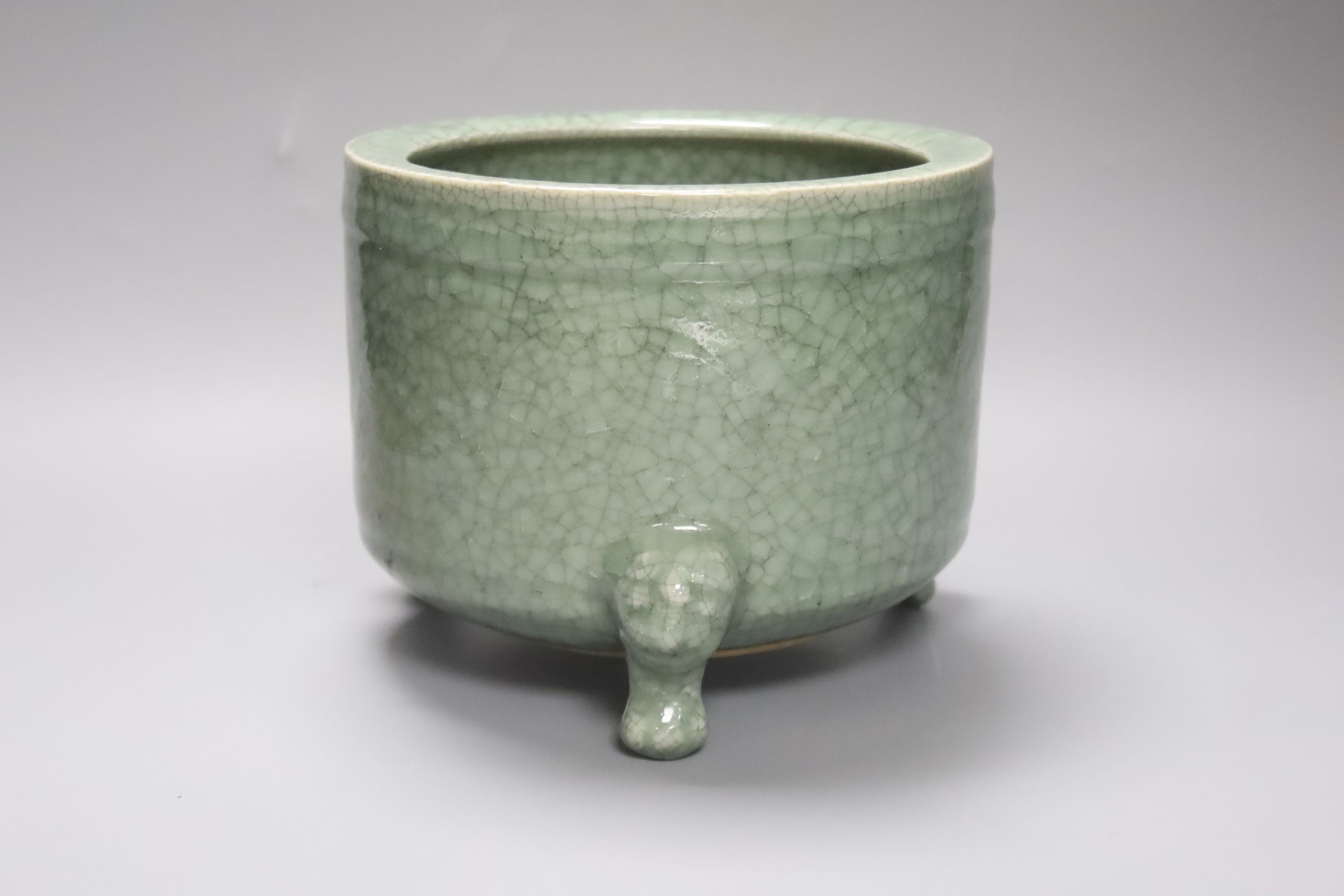 A large Chinese celadon crackleglaze tripod censer 15cm